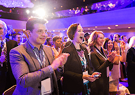 The crowd at Inman Connect New York 2016 standing, smiling and applauding