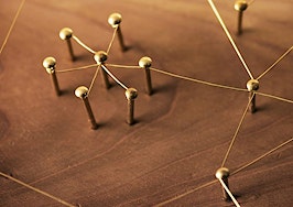 A network of threads connecting pins on a board