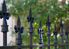 A gated fence around a park