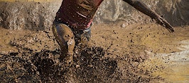A racer running through mud