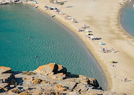 The Kolona double sided beach at Kythnos, Greece as viewed from Aghios Loukas islet
