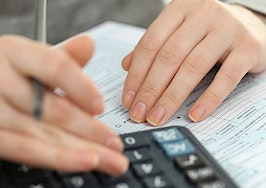 A woman filling out a tax form