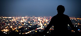 A man gazing into the city skyline