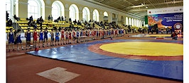 A group of wrestlers at a mat