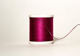 Spool of thread yarn unraveling